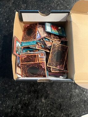 Yu-Gi-Oh! Trading Card Lot - Mixed Backs Visible (Black & Brown Swirl)